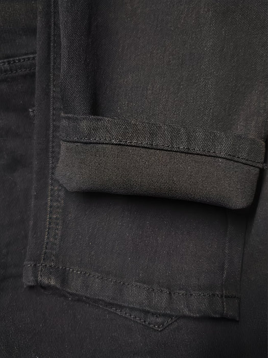Jeans ajustados elásticos negros para hombre con diseño desgarrado moderno