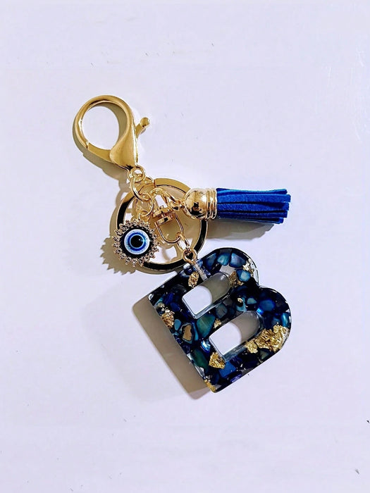 1 pieza Llavero con inicial de letra de resina azul elegante con ojo malvado y borla - Quierox - Tienda Online