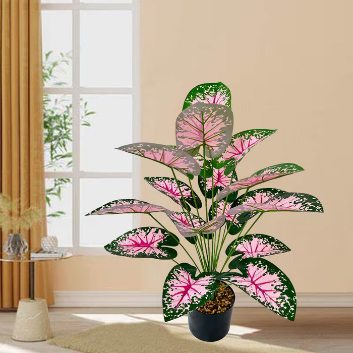 Planta de taro artificial colorida en maceta con un diseño nórdico