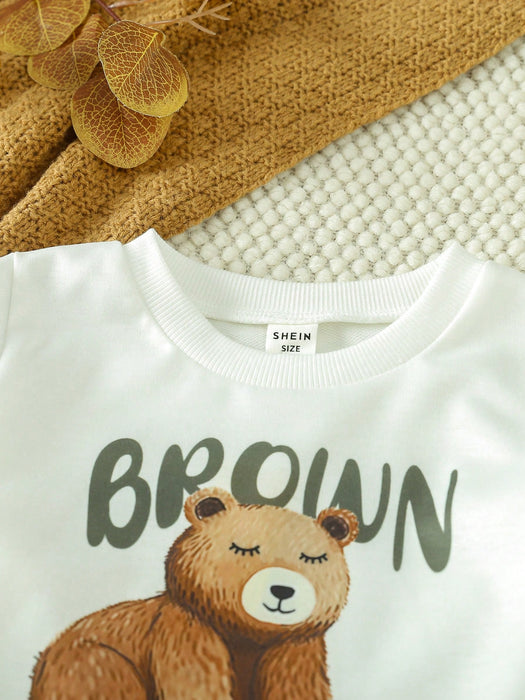 Shein Playful Pals Conjunto para niño de camiseta con ribete contrastante estampado de dibujos animados y pantalones