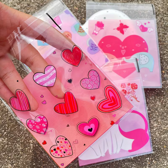 100pcs Bolsas autoadhesivas de plástico rosa de corazón romántico