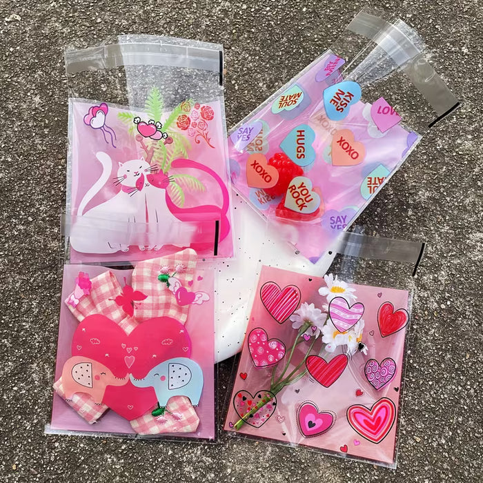 100pcs Bolsas autoadhesivas de plástico rosa de corazón romántico
