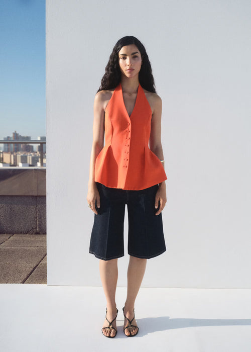 Chaleco peplum cuello halter