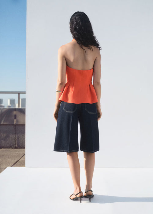 Chaleco peplum cuello halter