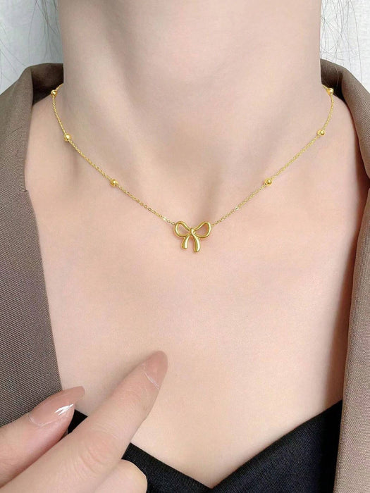 SHEIN 1 pieza Collar con colgante de lazo de acero inoxidable dorado