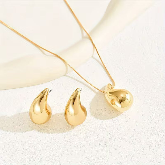 Conjunto de joyería de inspiración bohemio que incluye un collar de lágrima y aretes a juego
