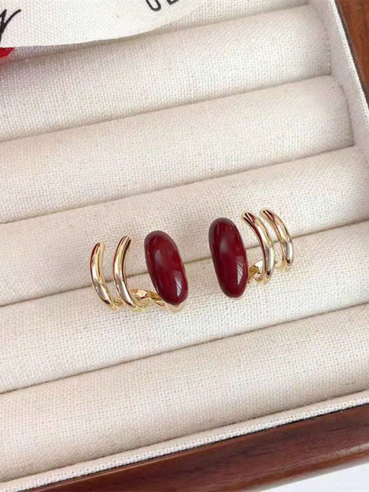 SHEIN 1 par de aretes únicos de color vino tinto