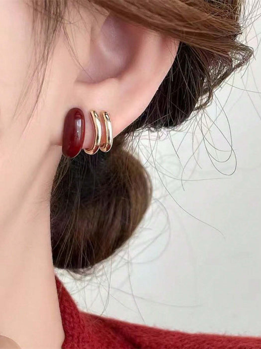 SHEIN 1 par de aretes únicos de color vino tinto