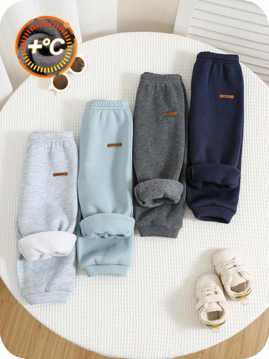 Shein 4 piezas de pantalones deportivos casuales de color liso con cintura elástica para niño
