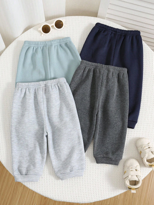 Shein 4 piezas de pantalones deportivos casuales de color liso con cintura elástica para niño