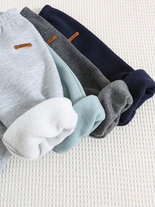 Shein 4 piezas de pantalones deportivos casuales de color liso con cintura elástica para niño