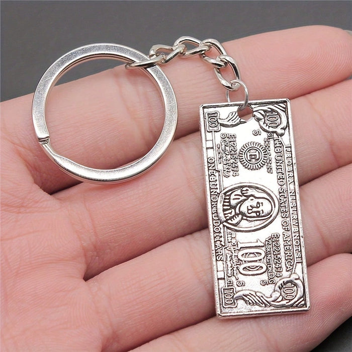 Llavero mini con el símbolo del dólar, estilo hip hop retro