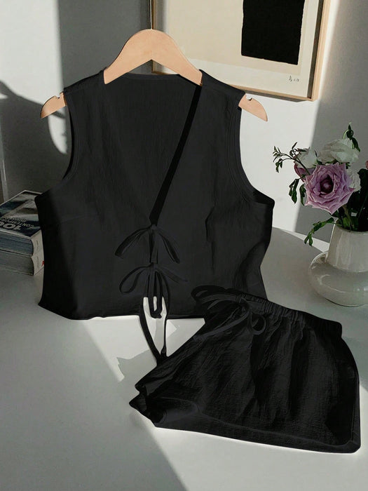 Shein Comfortcana Conjunto casual para mujer: top sin mangas anudado de color liso y shorts
