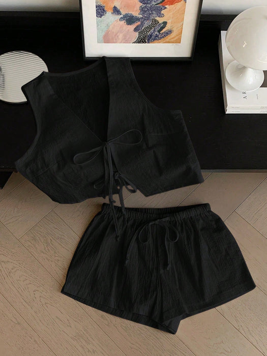 Shein Comfortcana Conjunto casual para mujer: top sin mangas anudado de color liso y shorts