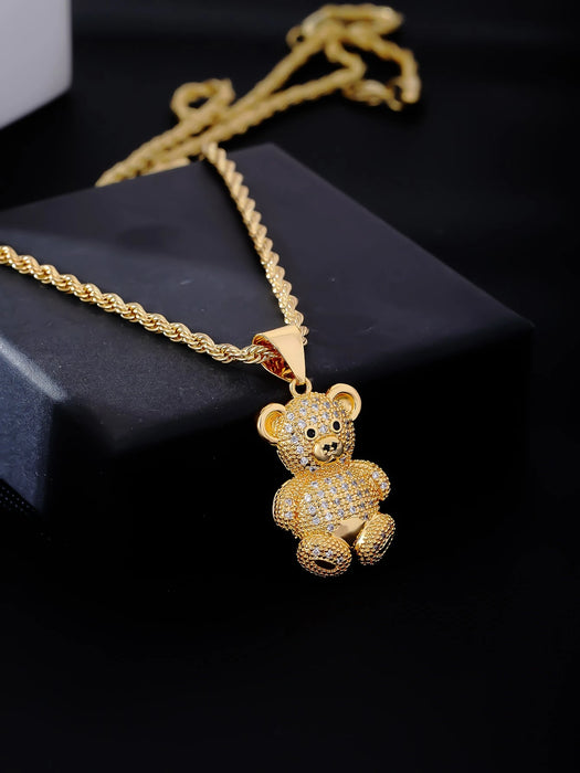 1 collar con colgante de osito de cobre en tono dorado y circonita cúbica.