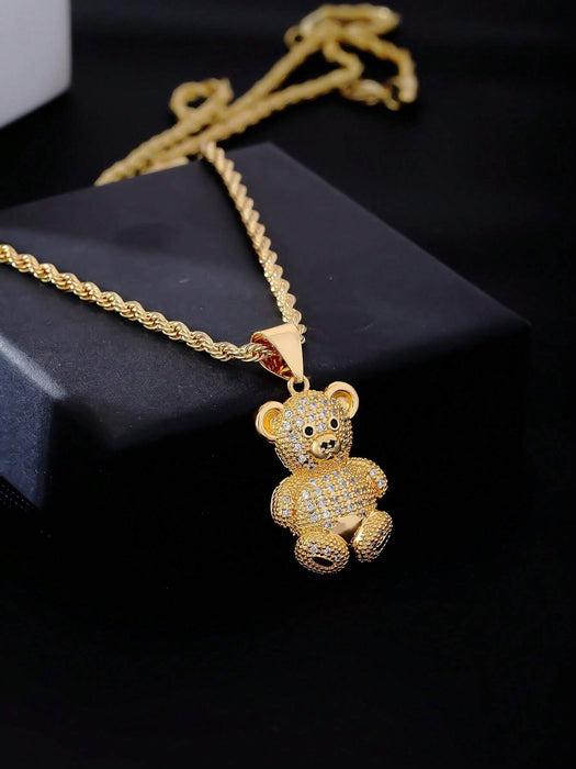 1 collar con colgante de osito de cobre en tono dorado y circonita cúbica.