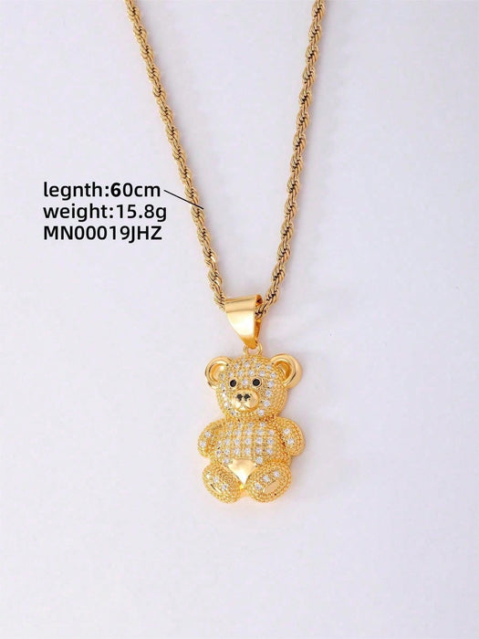 1 collar con colgante de osito de cobre en tono dorado y circonita cúbica.