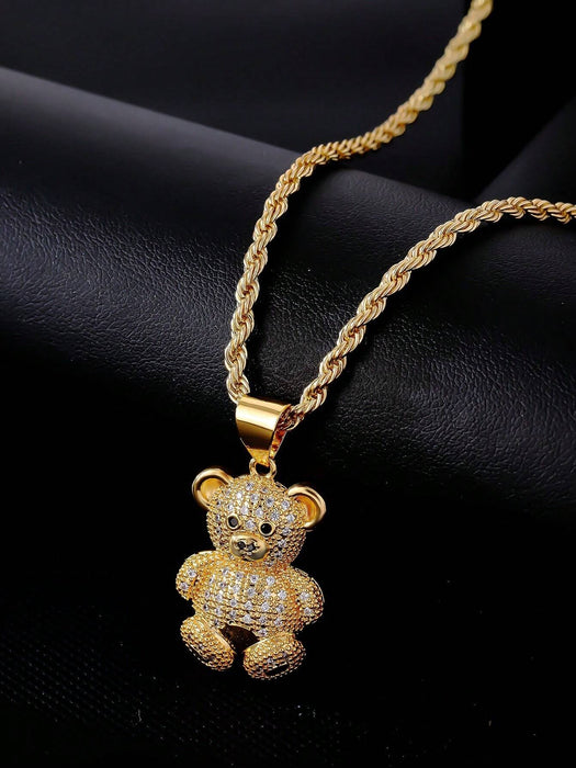 1 collar con colgante de osito de cobre en tono dorado y circonita cúbica.