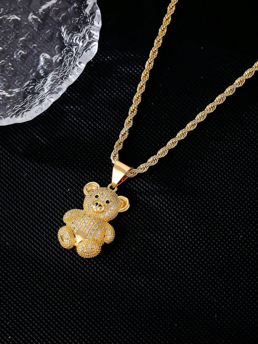 1 collar con colgante de osito de cobre en tono dorado y circonita cúbica.