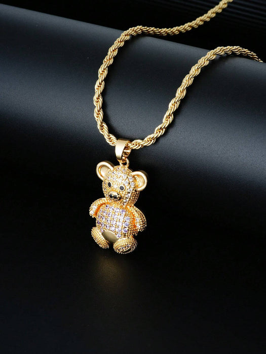 1 collar con colgante de osito de cobre en tono dorado y circonita cúbica.