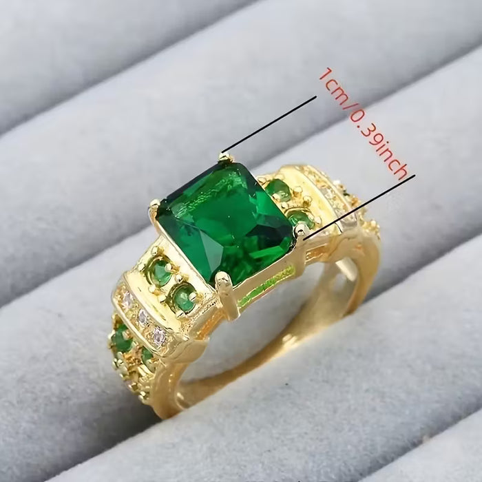 Anillo rectangular dorado de circonita sintética verde