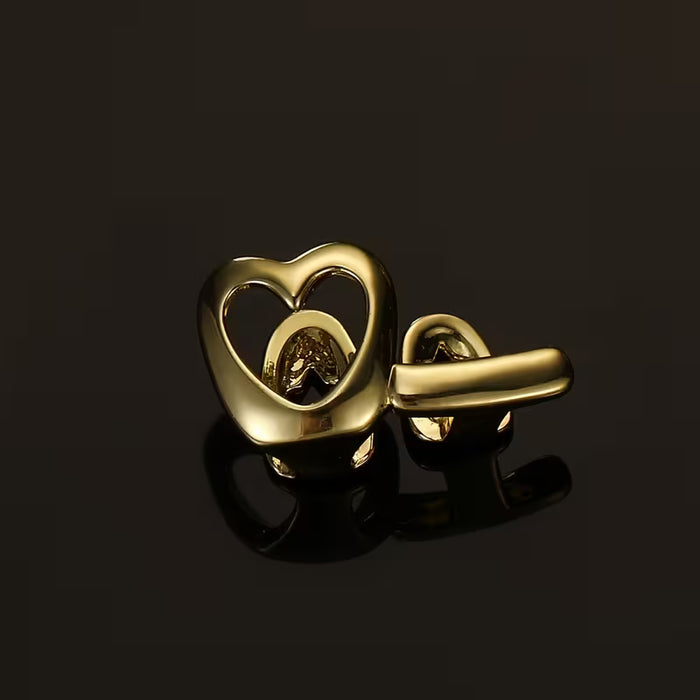 Shein Grillz de cobre en forma de corazón con diseño de rayas de amor huecas, acabado dorado