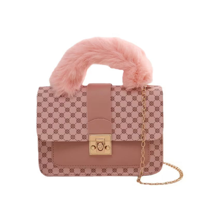 Bolso bandolera sofisticado con estampado y correa de cadena