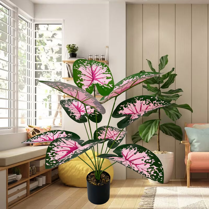 Planta de taro artificial colorida en maceta con un diseño nórdico