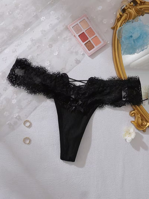 Tanga de una pieza transfronteriza cómoda con encaje y adorno de lazo