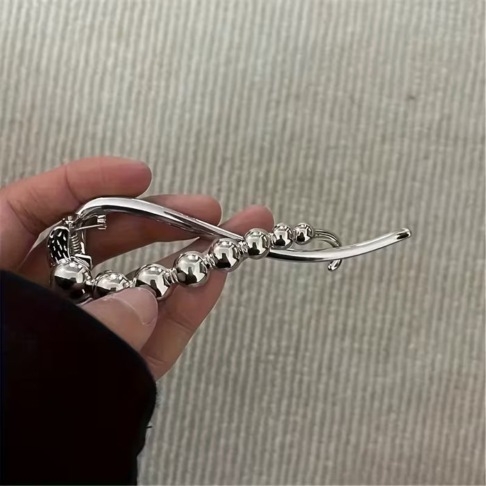 Pinza para el cabello con giro de pedrería