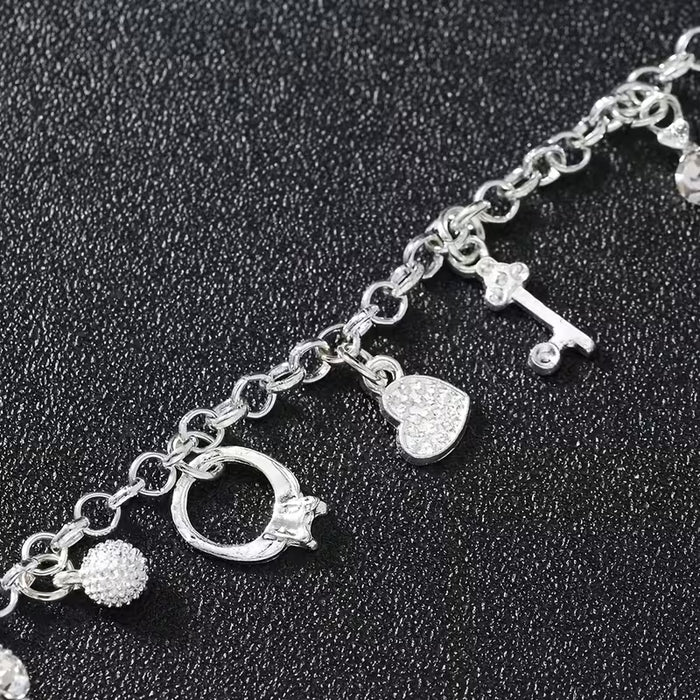 Pulsera con colgantes plateados de 13pcs, elegante con dijes como cruces, estrellas y llaves