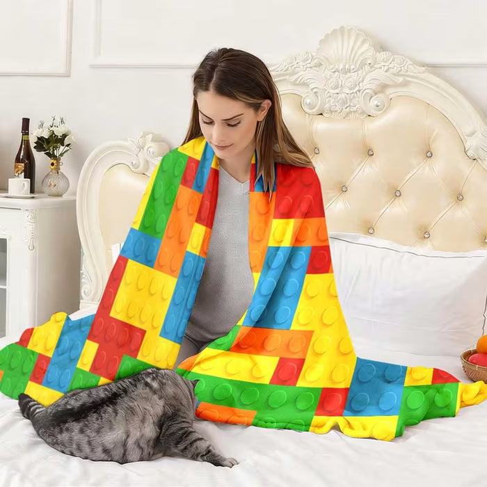 Manta de franela vibrante y acogedora con un diseño de rompecabezas colorido
