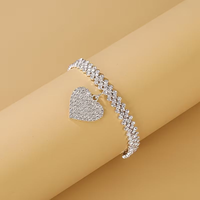 Pulsera con dije de corazón de diamantes de imitación