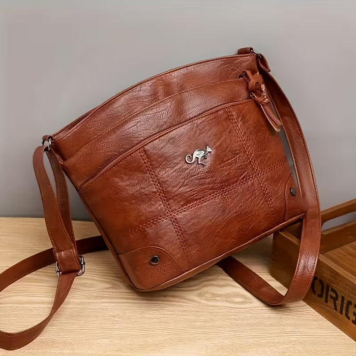 Una elegante y moderna bandolera de gran capacidad con múltiples bolsillos