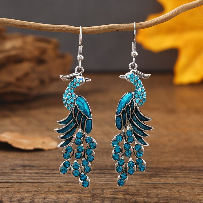 Shein Un par de pendientes colgantes modernos para mujer con diseño de pavo real