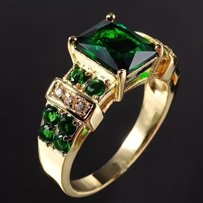 Anillo rectangular dorado de circonita sintética verde