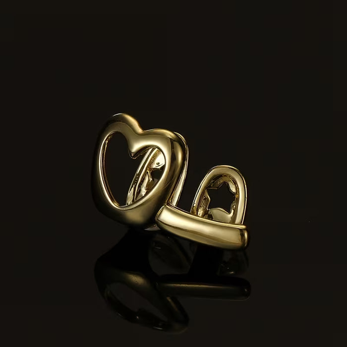 Shein Grillz de cobre en forma de corazón con diseño de rayas de amor huecas, acabado dorado