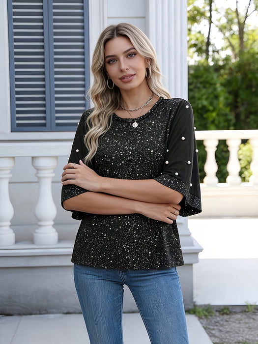Camiseta de mujer moderna y elegante con láminas brillantes y mangas de perlas