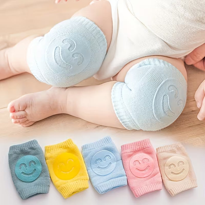 Rodilleras infantiles antideslizantes con cara alegre color rosa