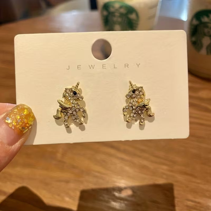 Pendientes de dije de unicornio con pedrería |únicas y elegantes
