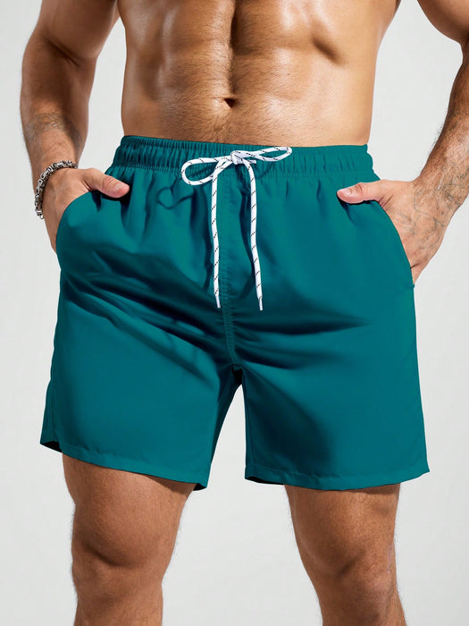 SHEIN Pantalones cortos de playa holgados y relajados con cordón para hombre