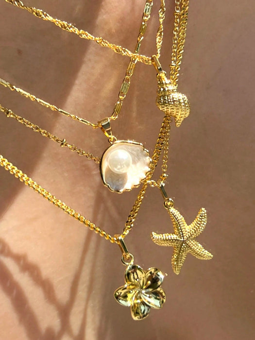 SHEIN Conjunto de 4 piezas de collar colgante con elementos de concha, estrella de mar y flor de perla