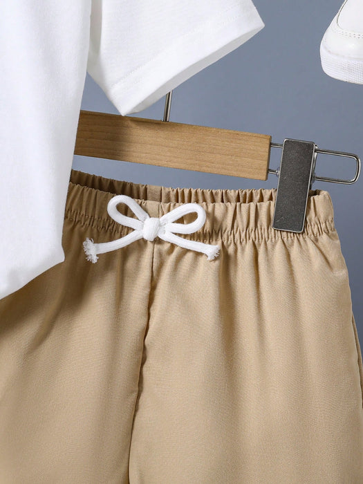 SHEIN Conjunto de camiseta y pantalón corto con estampado de dibujos animados para niños