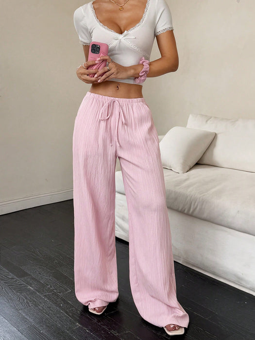 SHEIN Flirla Pantalones anchos con bolsillos y cintura ajustable de color liso para mujer