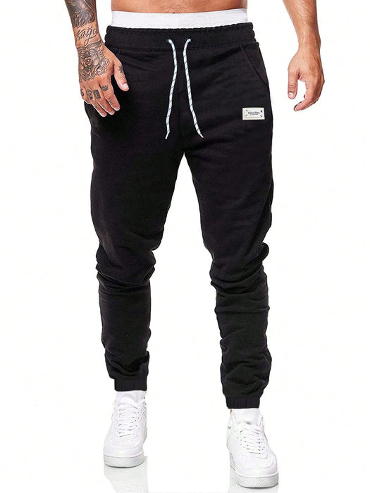 Manfinity Homme Pantalón de chándal con cordón y parche con letra para hombres