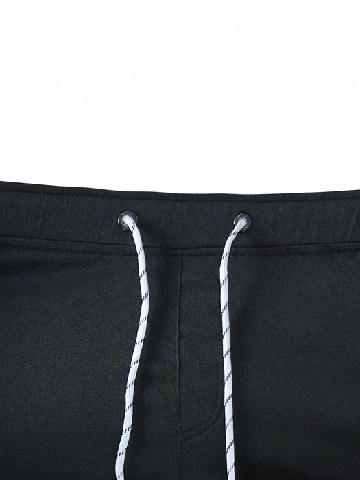 Manfinity Homme Pantalón de chándal con cordón y parche con letra para hombres