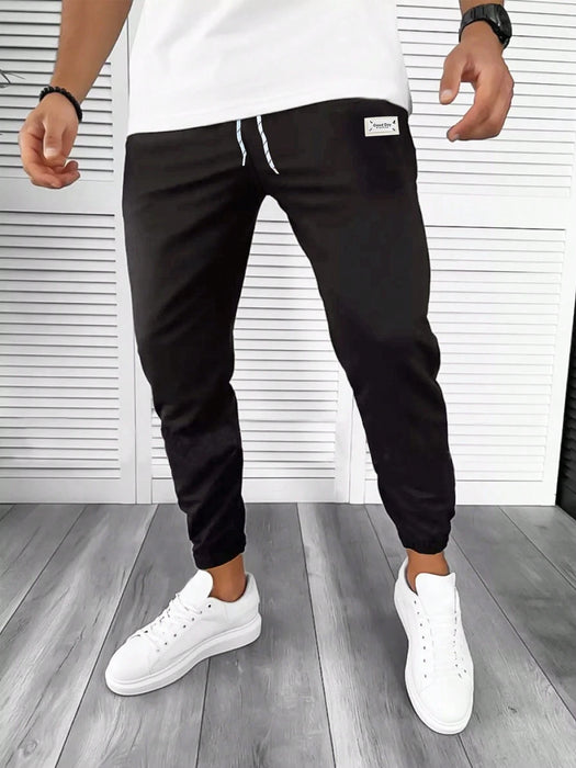 Manfinity Homme Pantalón de chándal con cordón y parche con letra para hombres