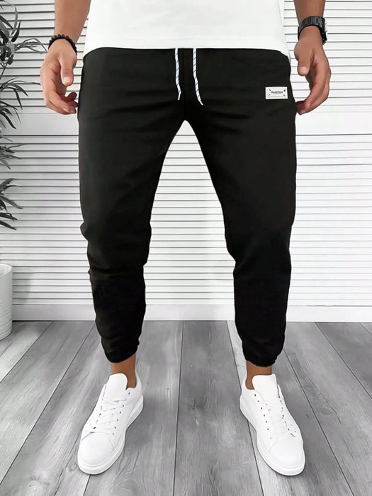 Manfinity Homme Pantalón de chándal con cordón y parche con letra para hombres