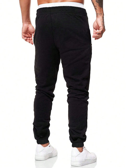 Manfinity Homme Pantalón de chándal con cordón y parche con letra para hombres