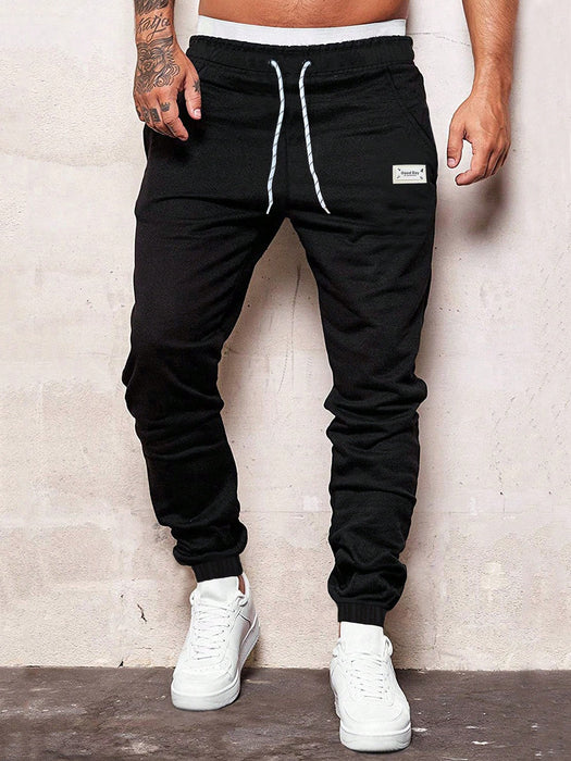 Manfinity Homme Pantalón de chándal con cordón y parche con letra para hombres